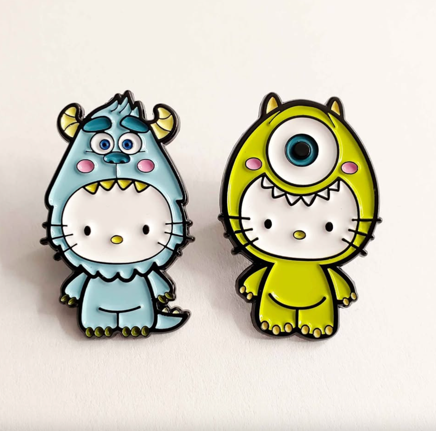 π Hello Kitty Monster Inc Enamel Pin Set β 2pcs Cute & Spooky Collectible Pins