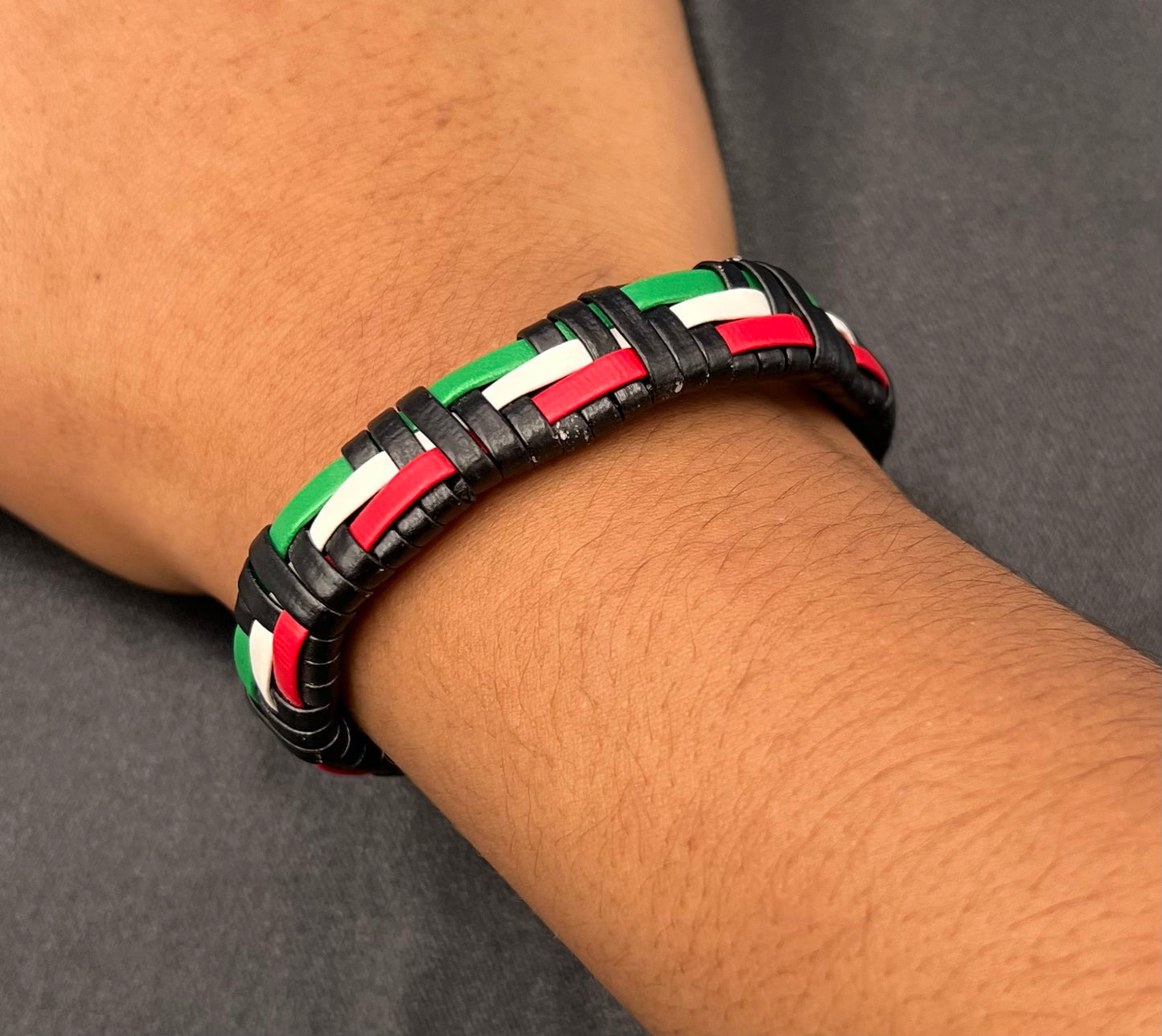 Black Geometric Leather Bracelet β Occident Style with Green, White & Red Accents