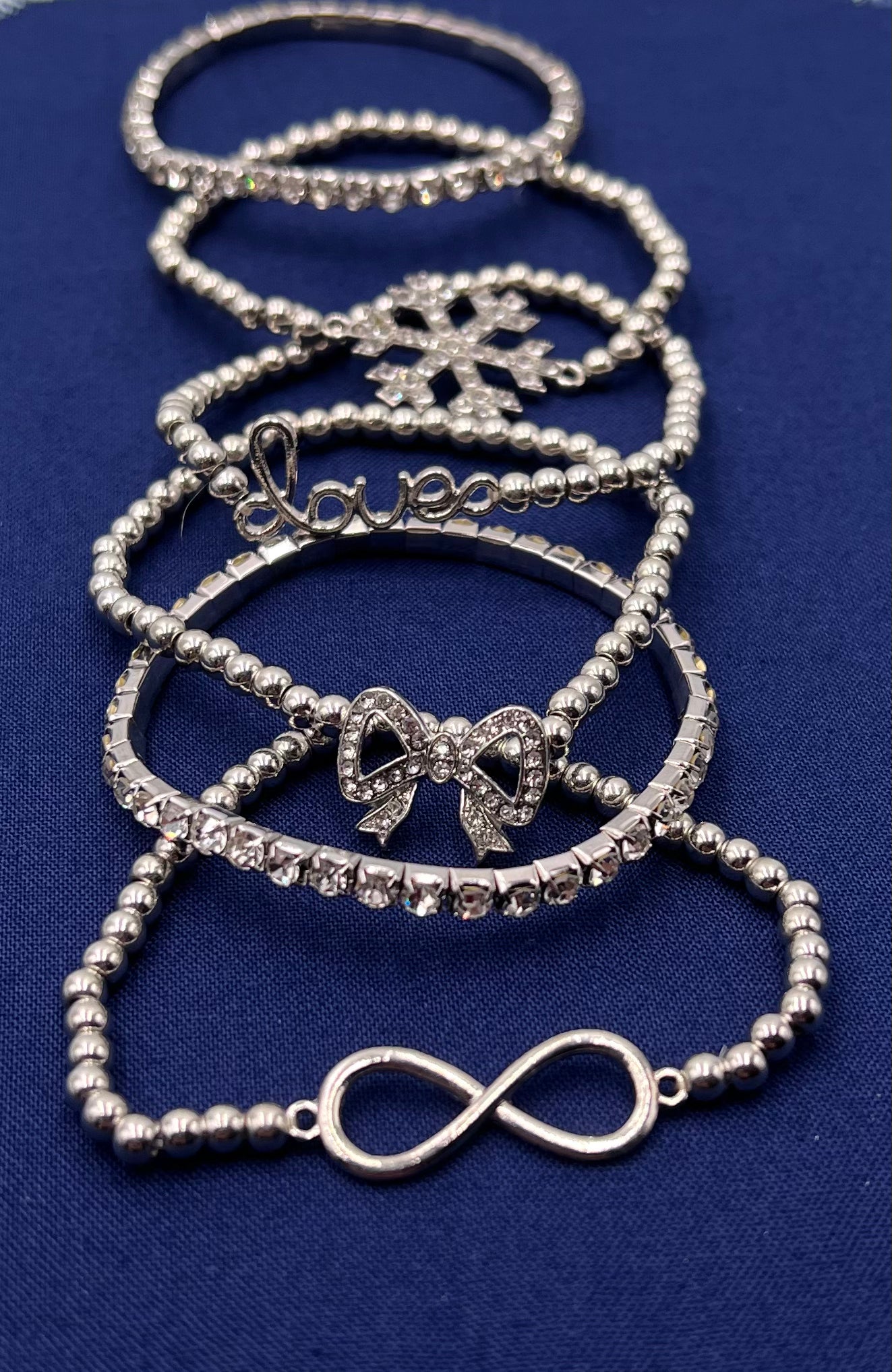 6-Piece Silver Bracelet Set for Women – Snowflake, Bowknot, Knot & Infinity Charms