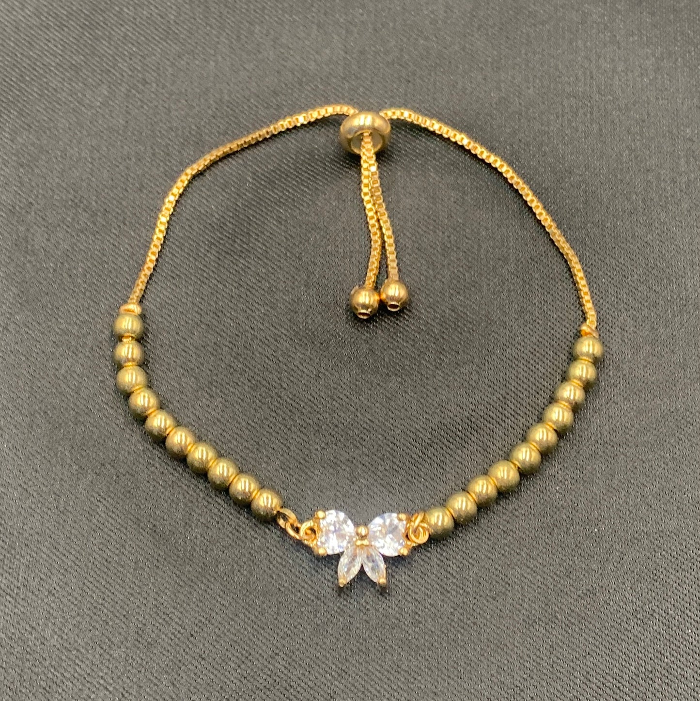 Gold Plated Adjustable Beaded Bow Bracelet – Micro-Set Zircon Charm